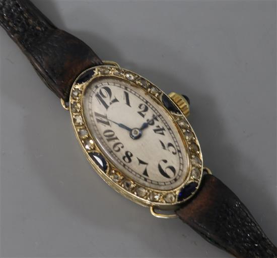A French 1920s/1930s 18ct white gold, diamond and gem set oval cocktail watch.